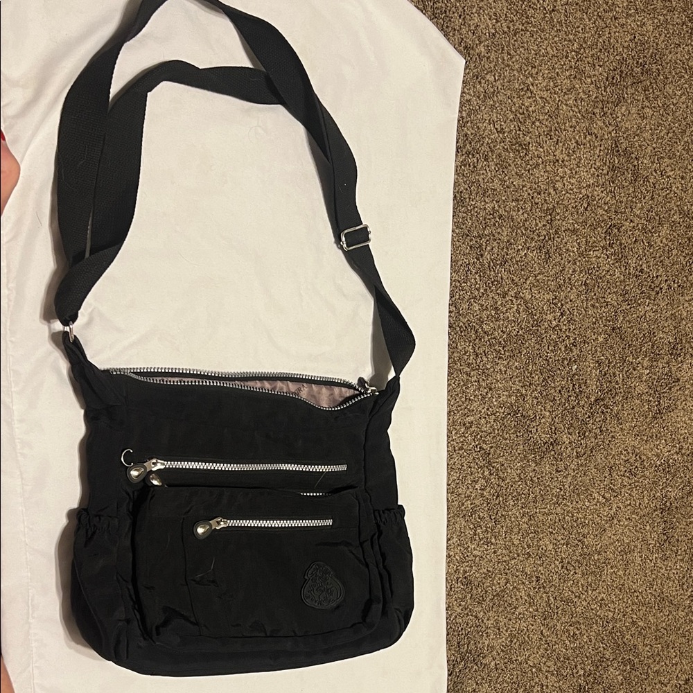 Mintegra black microfiber bag. Adjustable strap. Immaculate inside